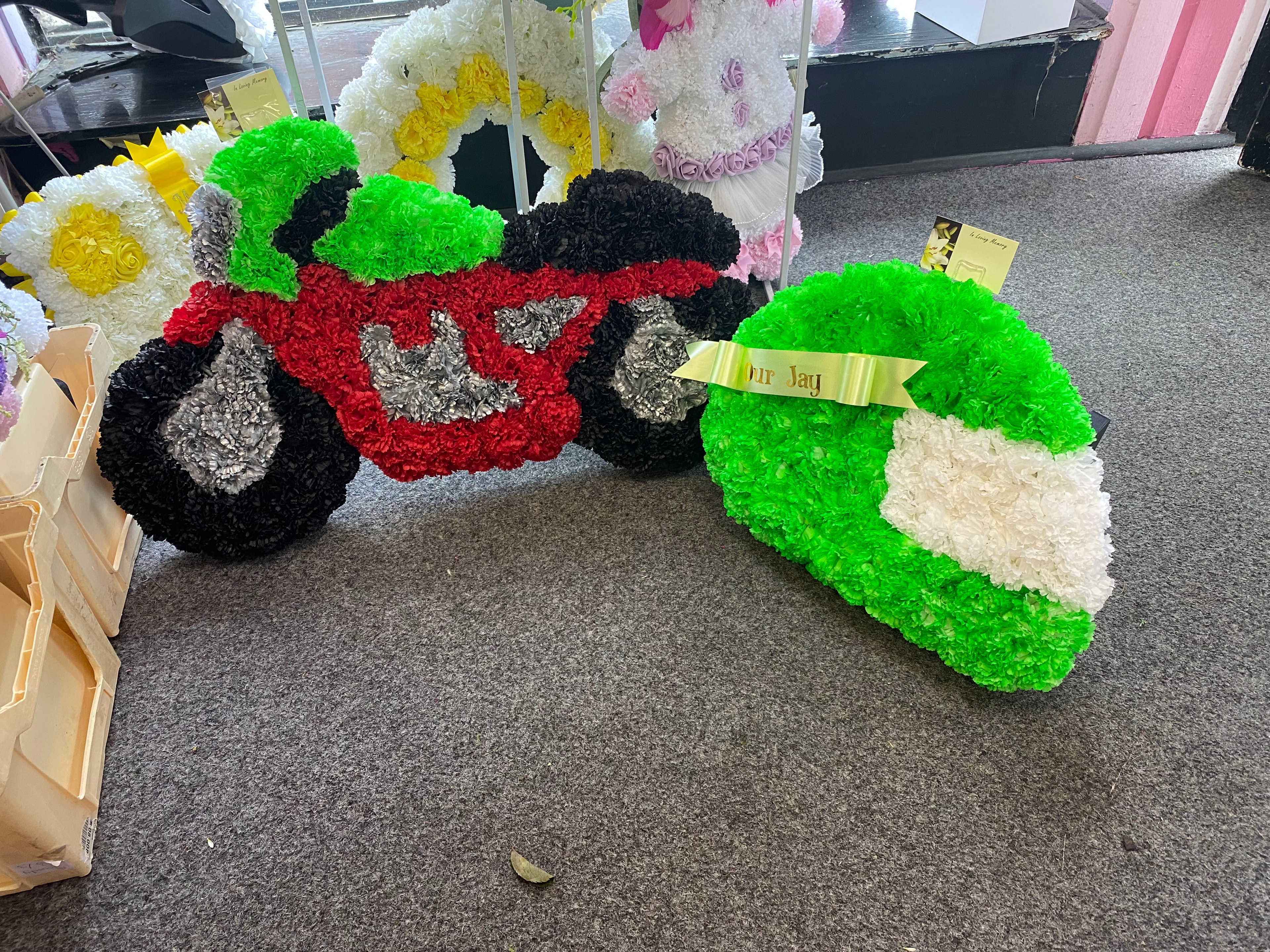 Colourful funeral casket spray arrangements