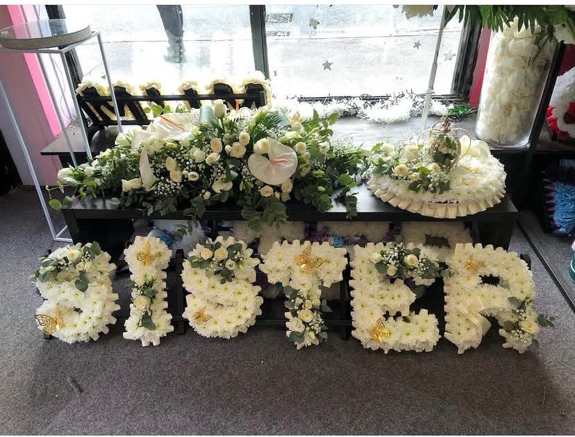 Funeral flower arrangements with white blooms
